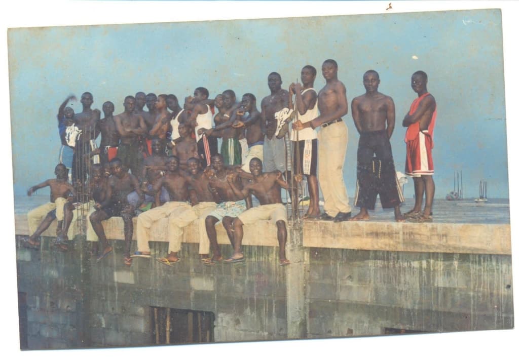 Alumni gathering on a ledge